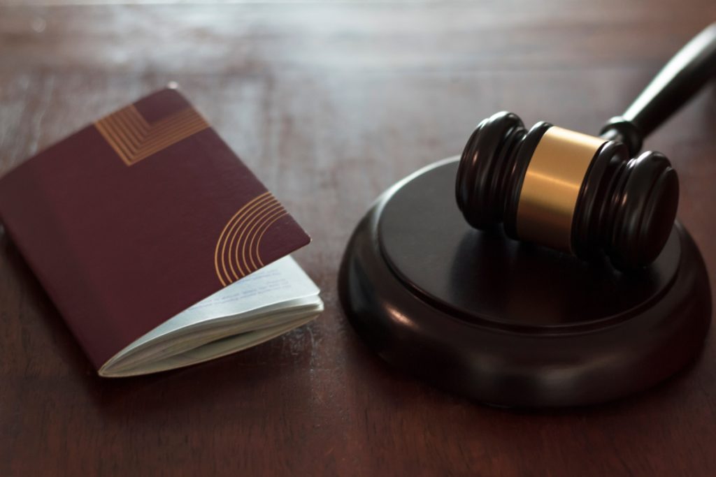 Gavel with passport next to it