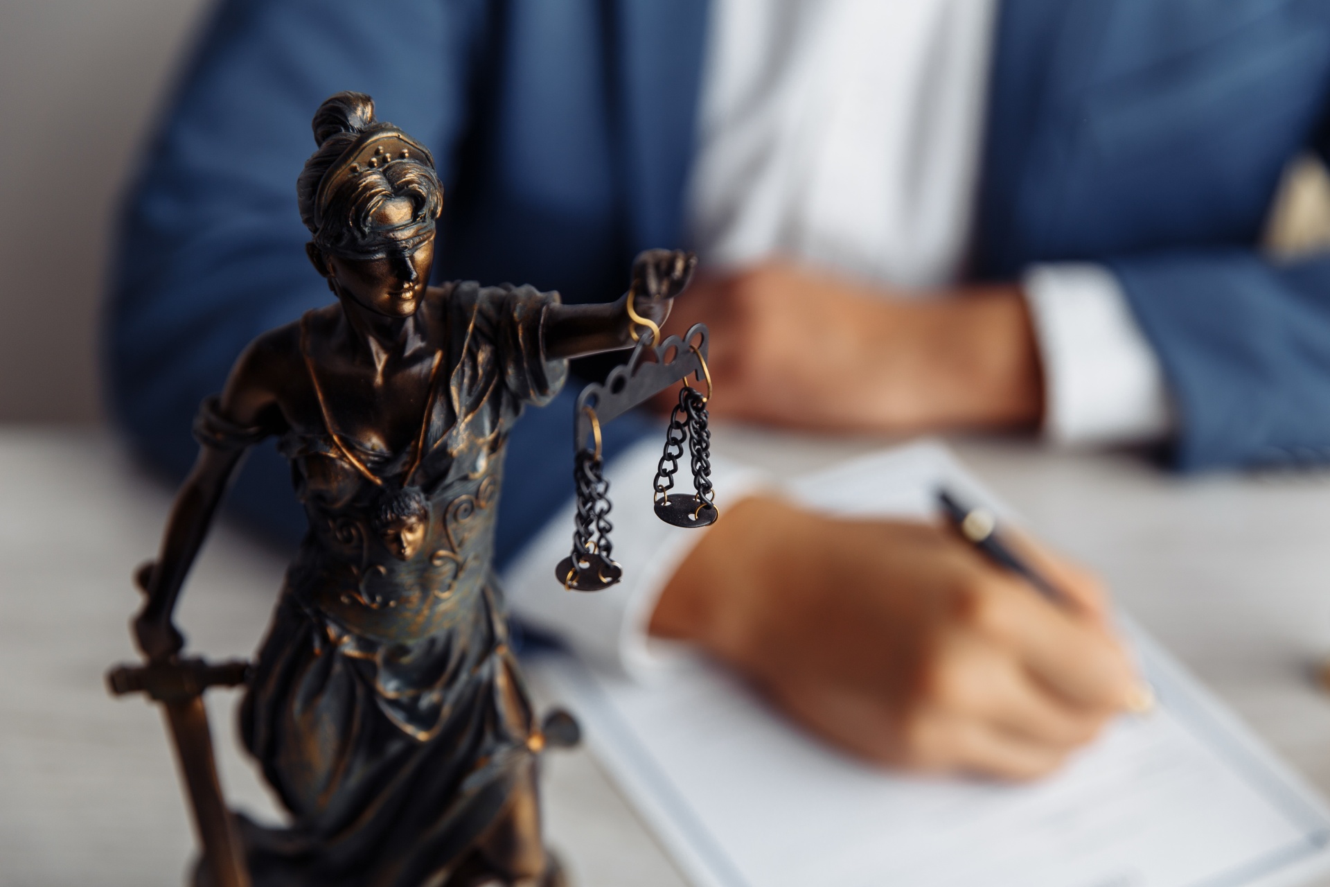 Lady justice on the office table of a legal professional where he's sitting